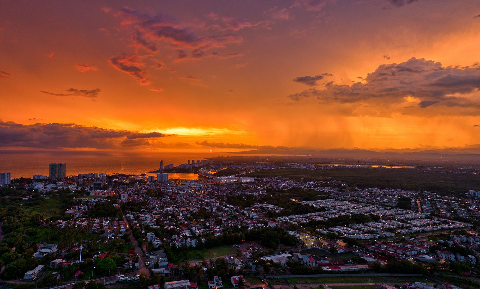 Sunset after the rain over the city, aerial view