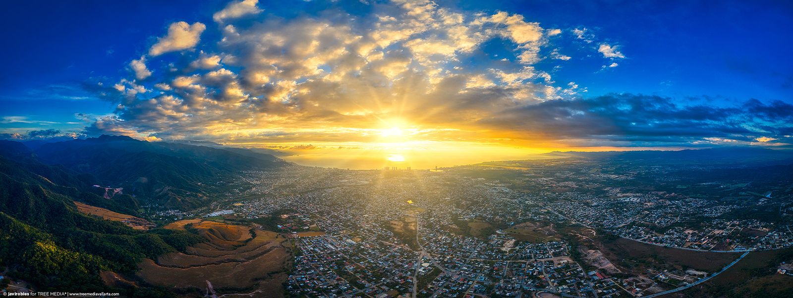 Golden sunrise over the valley seen from the air
